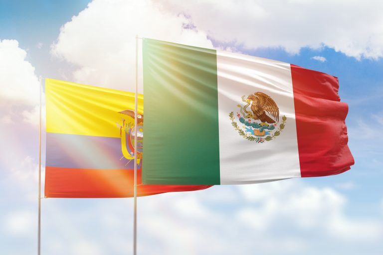 Sunny blue sky and flags of mexico and ecuador